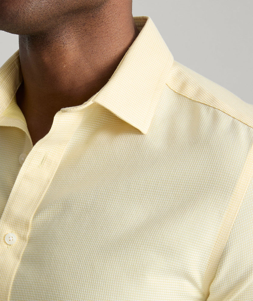 Model is wearing UNTUCKit Wrinkle-Free Burke Shirt in Textured Light Yellow.