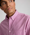 Model wearing an UNTUCKit Mid Red Wrinkle-Free Cadetto Shirt.