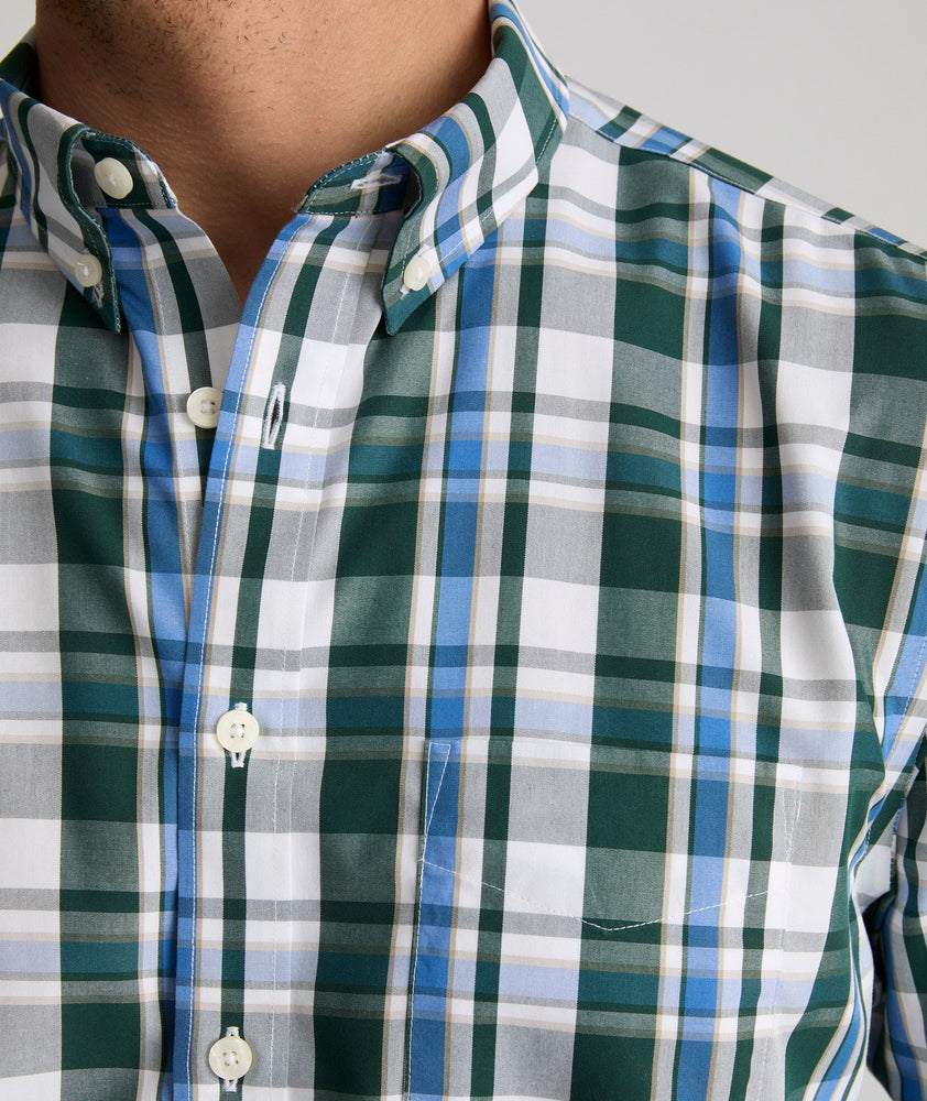 Model is wearing UNTUCKit Caldwell shirt in green large plaid.