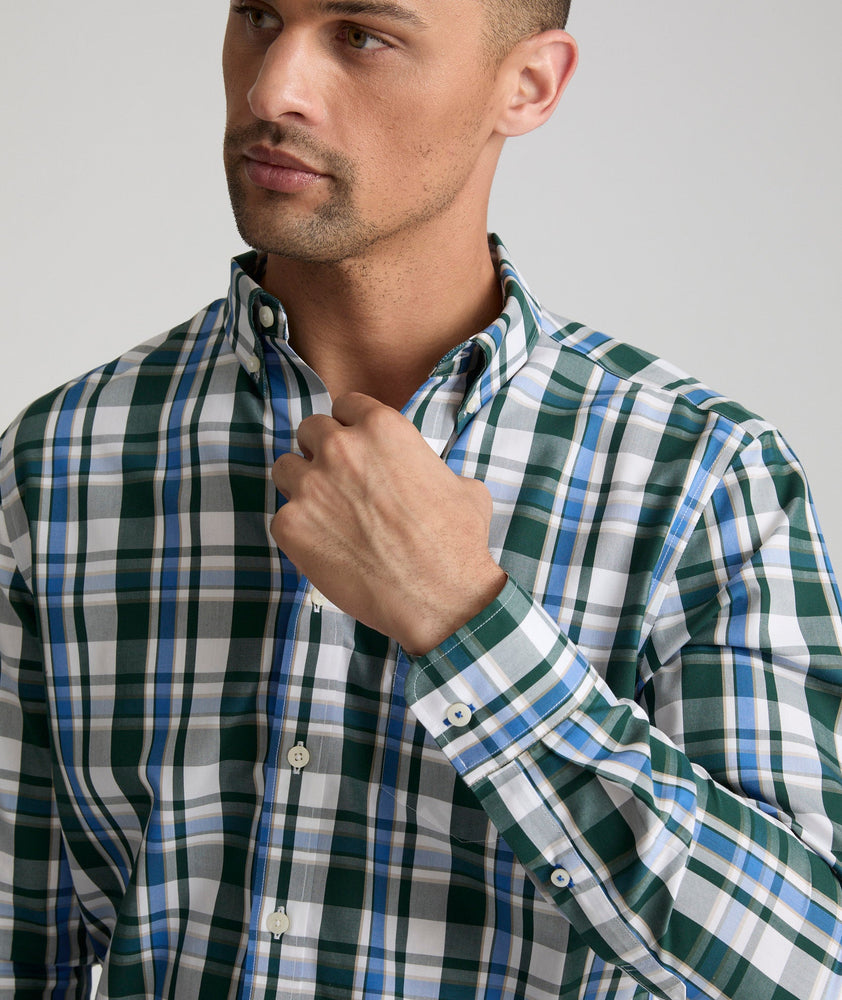 Model is wearing UNTUCKit Caldwell shirt in green large plaid.