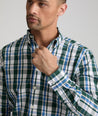 Model is wearing UNTUCKit Caldwell shirt in green large plaid.