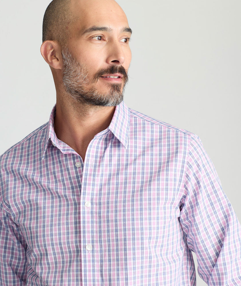 Model is wearing UNTUCKit dolcetto wrinkle free button down.