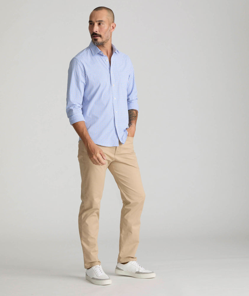 Model is wearing UNTUCKit 5-Pocket Chino Pants in Khaki.