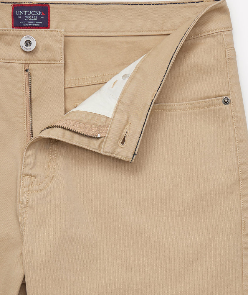 Model is wearing UNTUCKit 5-Pocket Chino Pants in Khaki.