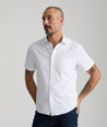 Model wearing an UNTUCKit White Wrinkle-Free Performance Short Sleeve Gironde Shirt