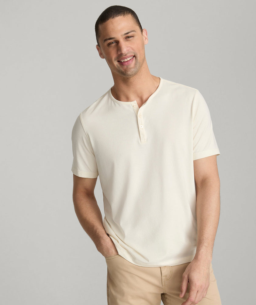 Model wearing an UNTUCKit white Essential Henley in EcoSoft™.