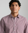 Model is wearing UNTUCKit Lawerence in maroon gingham. 