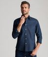 Model is wearing UNTUCKit Veneto shirt in teal.