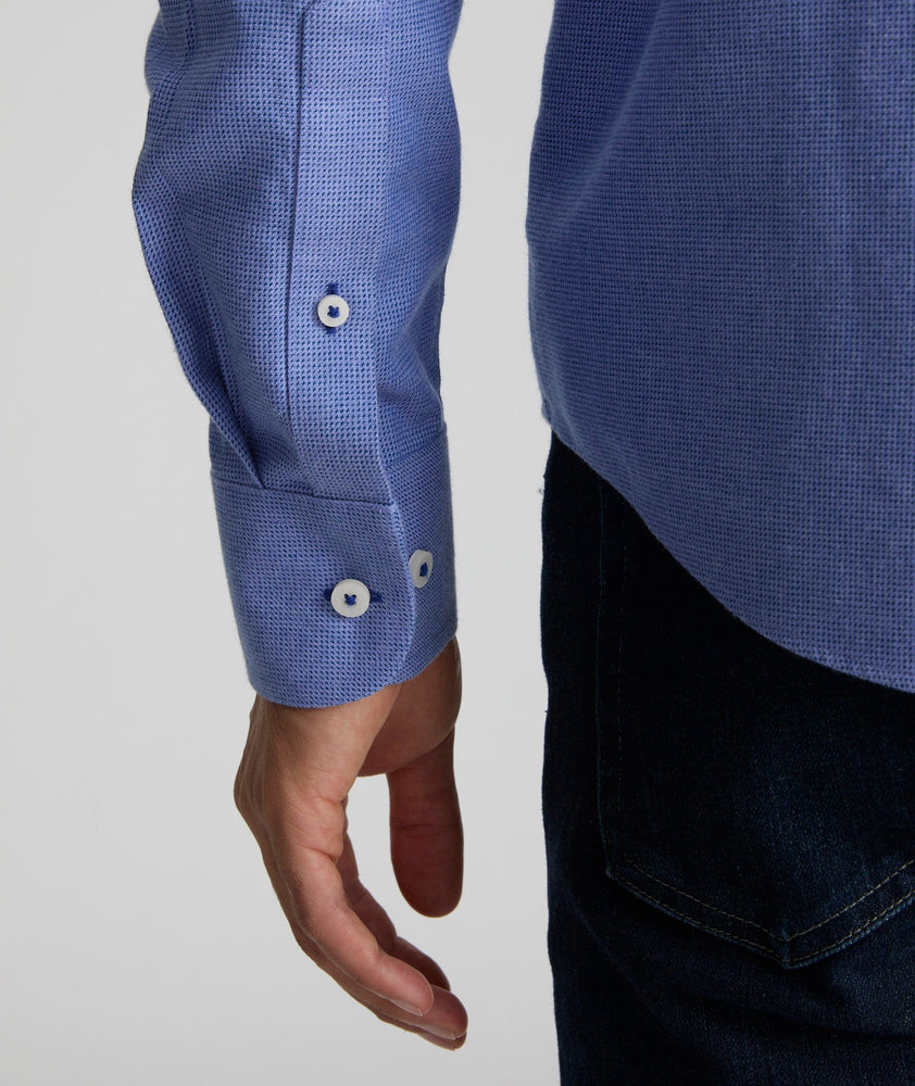 Model is wearing UNTUCKit Wrinkle-Free Veneto Shirt in light blue.