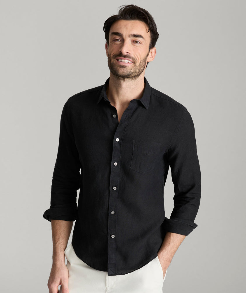 Model wearing an UNTUCKit Black Wrinkle-Resistant Linen Vin Santo Shirt