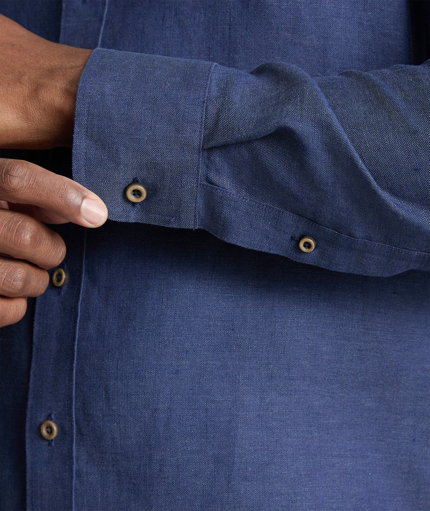 Model wearing an UNTUCKit Navy Wrinkle-Resistant Linen Vin Santo Shirt