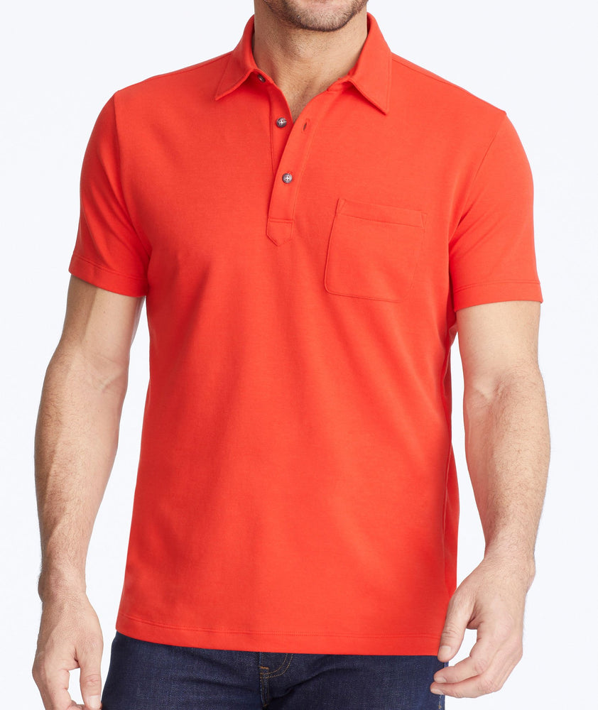 Model wearing a Red Traveler Polo with COOLMAX®