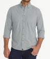 Model is wearing UNTUCKit Wrinkle-Free Performance Rowan-Brown Shirt in Small Teal & Olive Check.