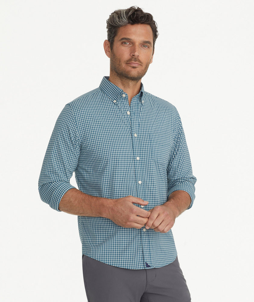 Model is wearing UNTUCKit Wrinkle-Free Performance Tully Shirt inTeal & White Check.