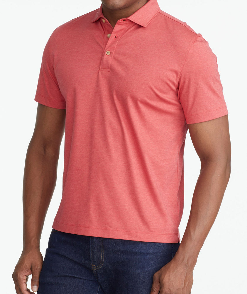 A model wearing a Red Luxe Wrinkle-Free Pique Polo