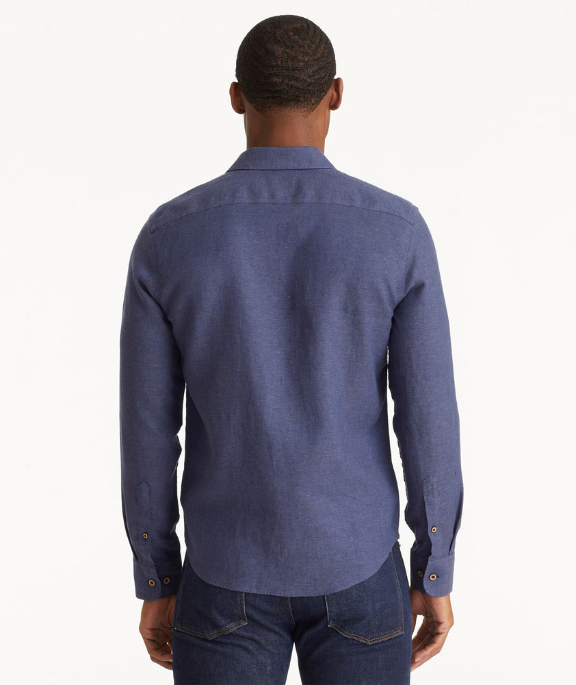 Model wearing an UNTUCKit Navy Wrinkle-Resistant Linen Vin Santo Shirt