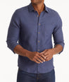 Model wearing an UNTUCKit Navy Wrinkle-Resistant Linen Vin Santo Shirt