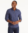 Model wearing an UNTUCKit Navy Wrinkle-Resistant Linen Vin Santo Shirt